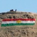 A Kurdish flag appears on a mountain in the town of Tuz Khurmatu, in northern Iraq's Kirkuk province on December 27, 2012. (MARWAN IBRAHIM/AFP/Getty Images)