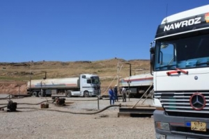 Tankers filling up at the Tawke field station in June 2008. (source: Ben Lando)