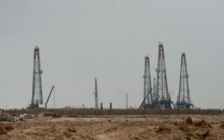 partial view shows the Iraqi oil field of Rumaila near the southern port city of Basra on December 11, 2009. (ESSAM AL-SUDANI/AFP/Getty Images)