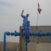 A worker of Iraq's Missan Oil Company at the Fakka oil field well number 13 on Dec. 25, 2009. On Dec. 18, Iranian forces briefly took over oil well number 4, causing a minor row between Baghdad and Tehran. (STAFF/Iraq Oil Report)