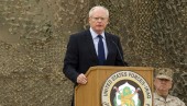 U.S. ambassador to Iraq Jeffrey speaks during ceremony for U.S. military to retire its ceremonial flags, signifying end of military presence in Iraq, at Baghdad Diplomatic Support Center