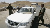 Kurdish Peshmerga soldiers man a checkpoint in Kirkuk