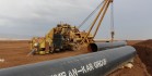 Pipe-laying machine stands beside sections of 36" diameter steel pipe, which await welding next to a trench dug 5 km west of the town of Sumel in Dohuk province. (PATRICK OSGOOD/Iraq Oil Report)