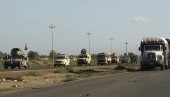 Iraqi troops travel in military vehicles towards Hawija, near Kirkuk